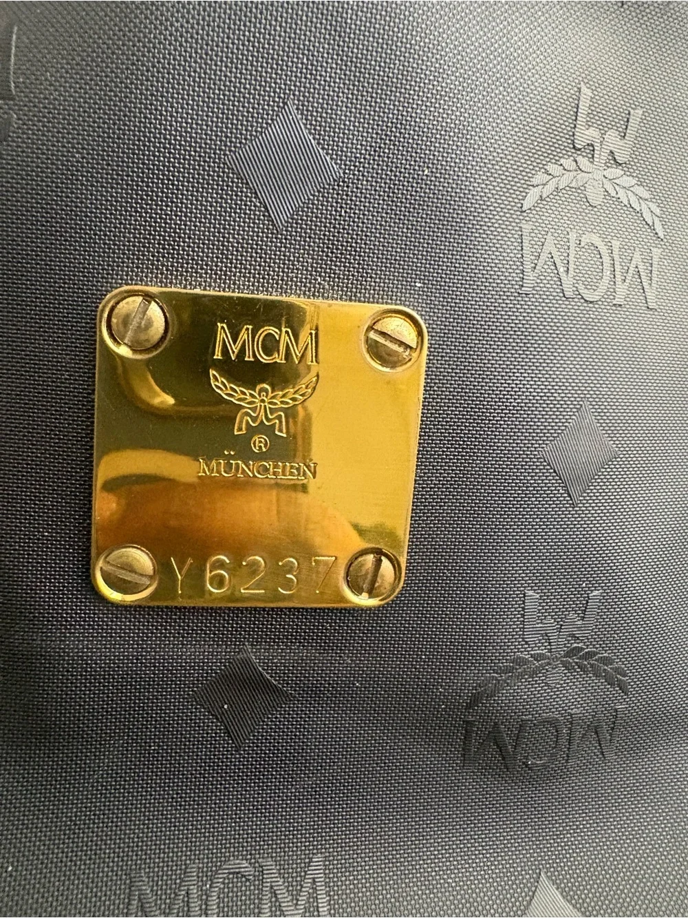 MCM Black Embossed Logo Toiletry Bag with Gold Plaque